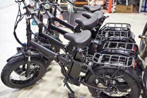 black e-bikes lined up next to each other